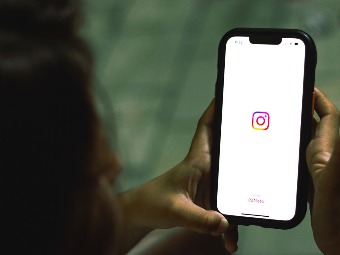 A smartphone showing a polished clinic Instagram profile with a curated grid of before and after treatment photos, team shots, follower count, and a Book Now link in the bio, styled with ClinicsRise navy and teal accents
